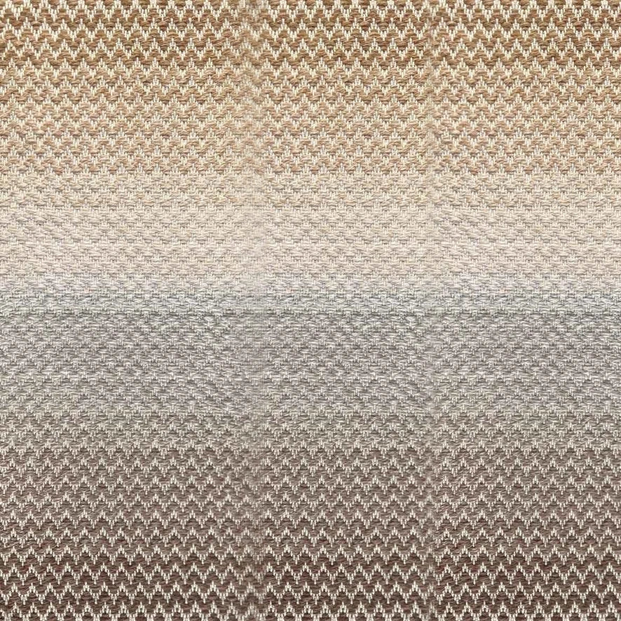 Broadloom carpet in a herringbone pattern in a subtle ombré color from warm brown to tan.