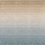 Broadloom carpet in a herringbone pattern in a subtle ombré color from teal blue to warm sand.