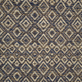 Handwoven rug detail in a diamond design in blue, cream and yellow