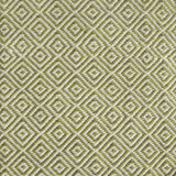 Detail of handwoven rug with diamond pattern in cream and lime green. 