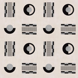 Graphic geometric pattern of circles, and stripes in black and grey on a cream field.