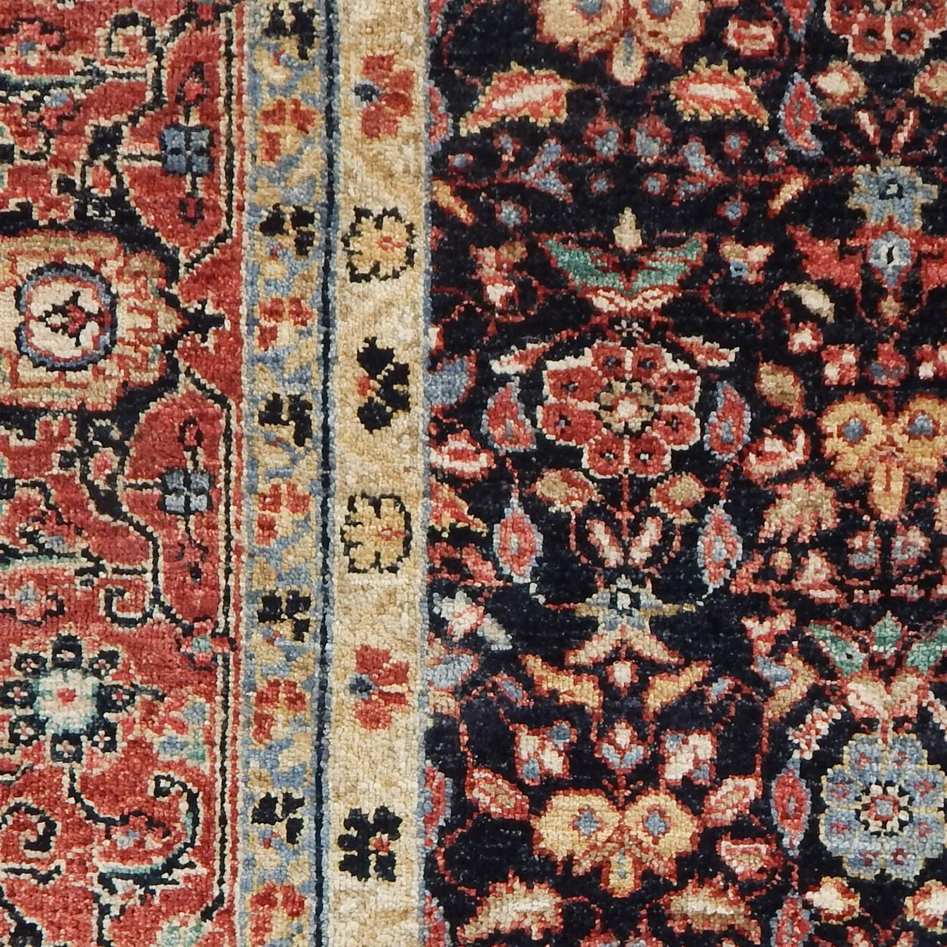 Close-up of a patterned rug with intricate designs.