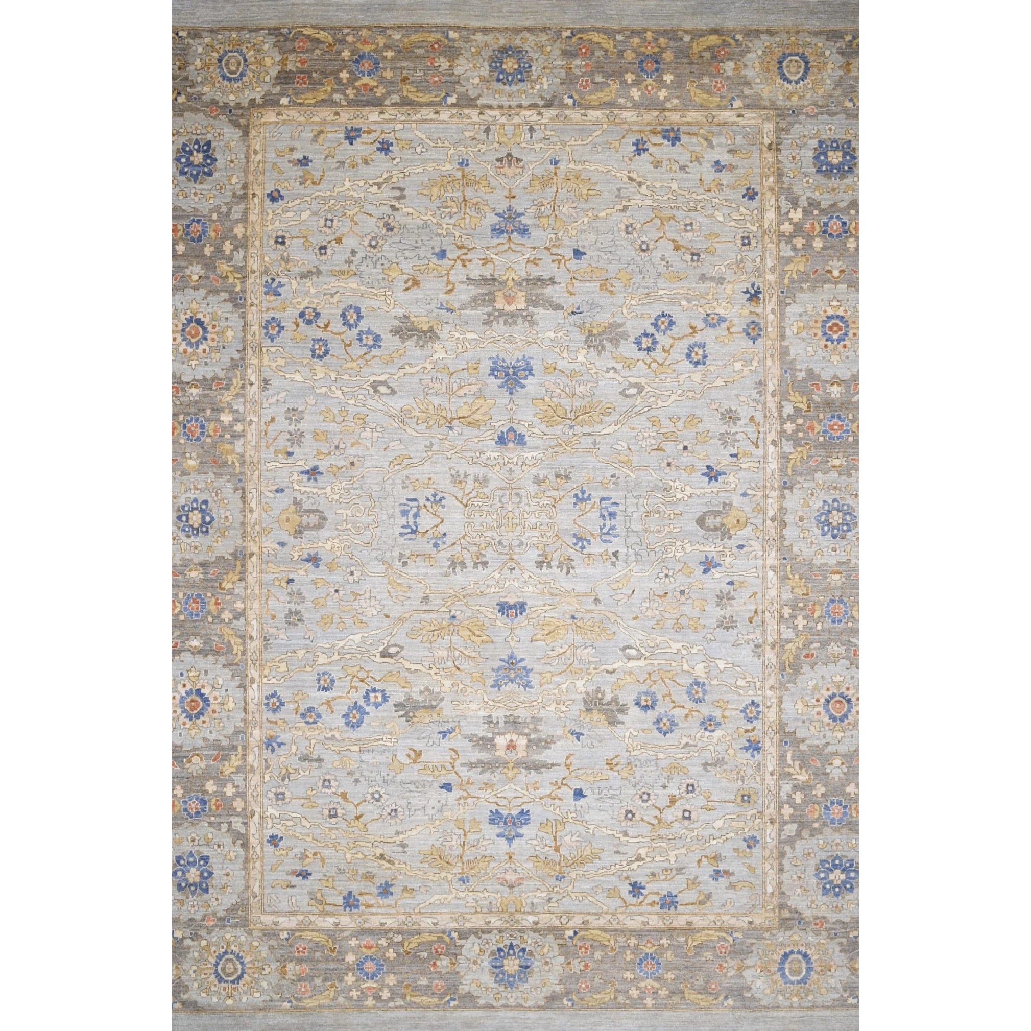Handknotted rug with an ornate Damascus design in blue, grey, and tan. 