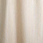 Draped fabric with hand drawn ticking stripe in caramel and grey on white.