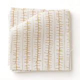 Swatch of fabric with hand drawn ticking stripe in caramel and grey on white.
