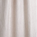 Draped fabric with hand drawn ticking stripe in shades of purple on white.