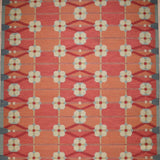Decorative rug with geometric pattern on a red background
