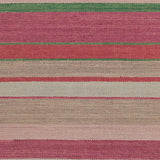 Flatweave rug in a mixed width stripe in fuchsia, coral, green, taupe and aqua.
