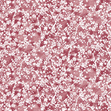 Painterly branch print in white on a berry red watercolor field.