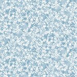 Painterly branch print in white on soft blue watercolor field.