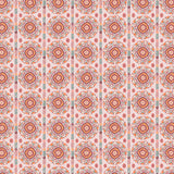 Full repeat image of a hand-drawn Suzani motif in shades of pink, orange and slate blue on a pale pink ground.