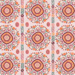 Detail of a hand-drawn Suzani motif in shades of pink, orange and slate blue on a pale pink ground.