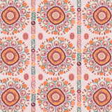 Detail of a hand-drawn Suzani motif in shades of pink, orange and slate blue on a pale pink ground.
