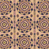 Detail of a hand-drawn Suzani motif in shades of purple, brown and lime green on a buff pink ground.
