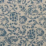 Textile pattern with blue floral and leaf designs on a beige background