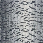 Broadloom carpet in a tiger inspired pattern in shades of blue.