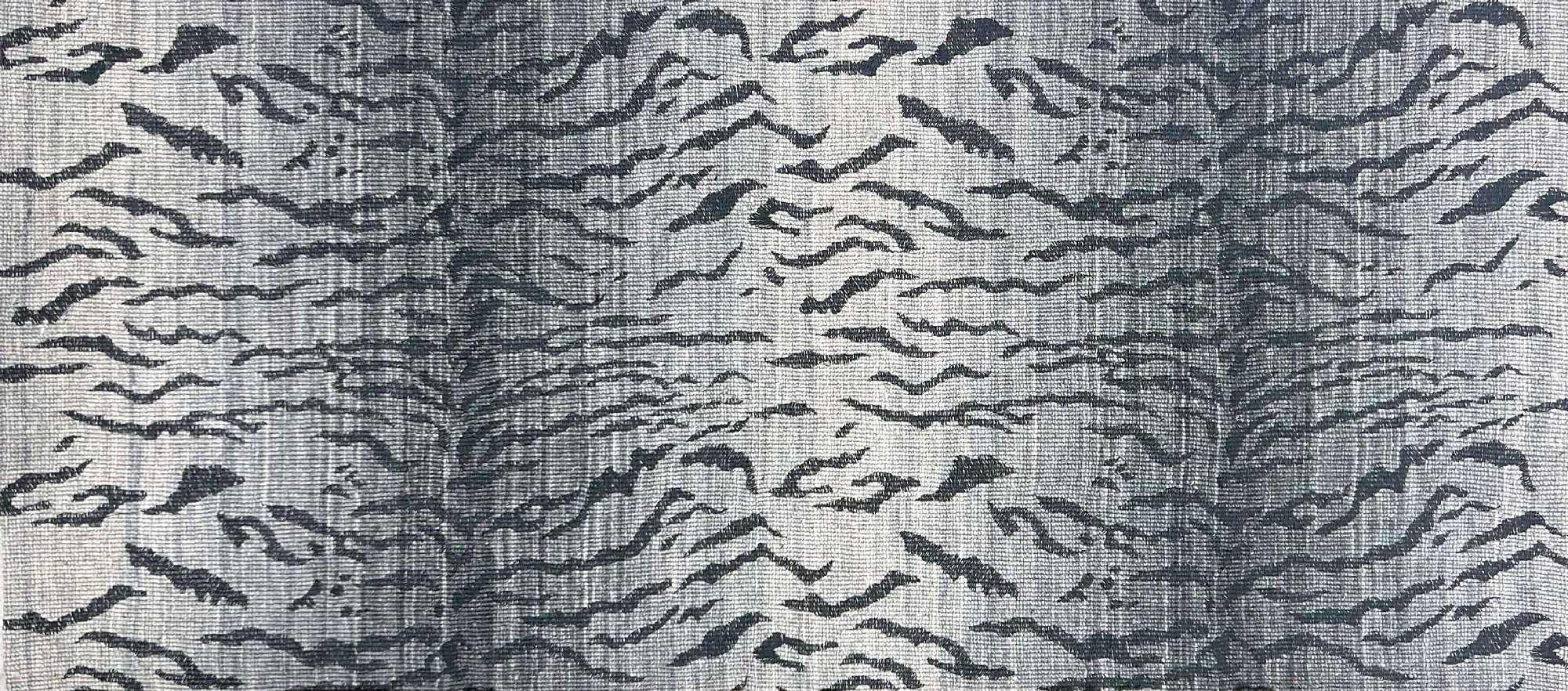 Broadloom carpet in a tiger inspired pattern in shades of blue.