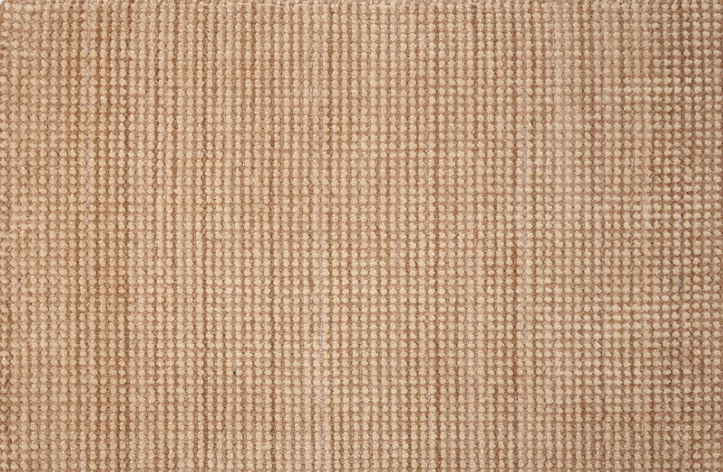 Broadloom carpet in a textural weave in camel. 