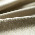 Close-up of textured beige fabric with a subtle pattern