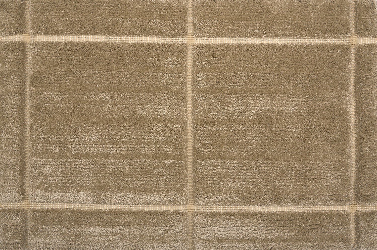 Textural performance broadloom carpet in grid design in tan.