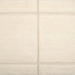 Textural performance broadloom carpet in grid design in cream
