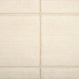 Textural performance broadloom carpet in grid design in cream