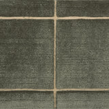 Textural performance broadloom carpet in grid design in dark green.