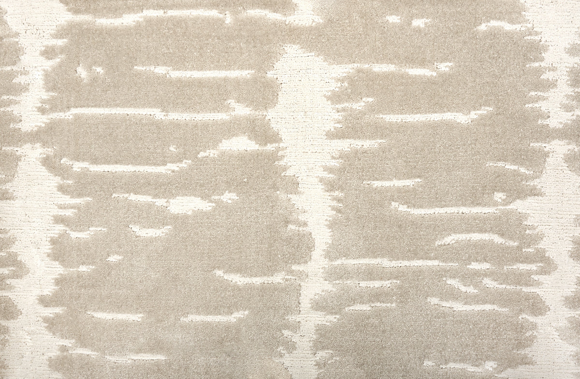 Broadloom carpet in a dimensional abstract painterly pattern in beige on a cream field.