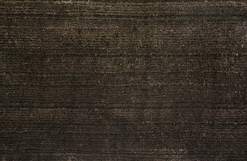 Broadloom carpet swatch in a solid pattern in a dark moss design