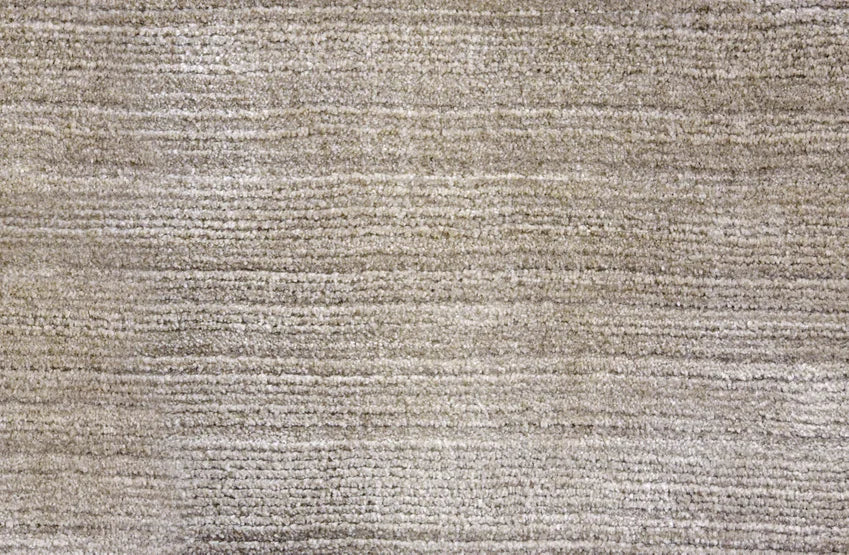 Broadloom carpet swatch in a solid pattern in a light tan design
