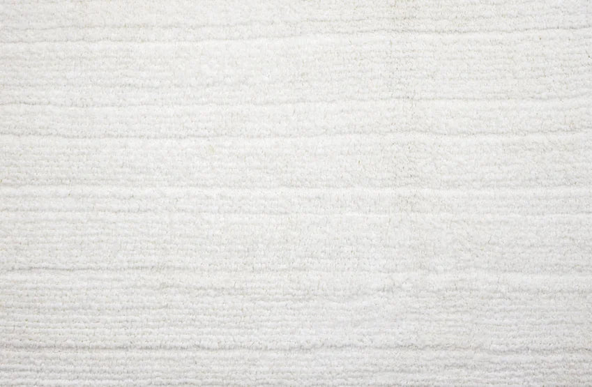 Broadloom carpet swatch in a solid pattern in a white design