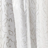 Draped sheer fabric in a hand drawn floral pattern in ivory.