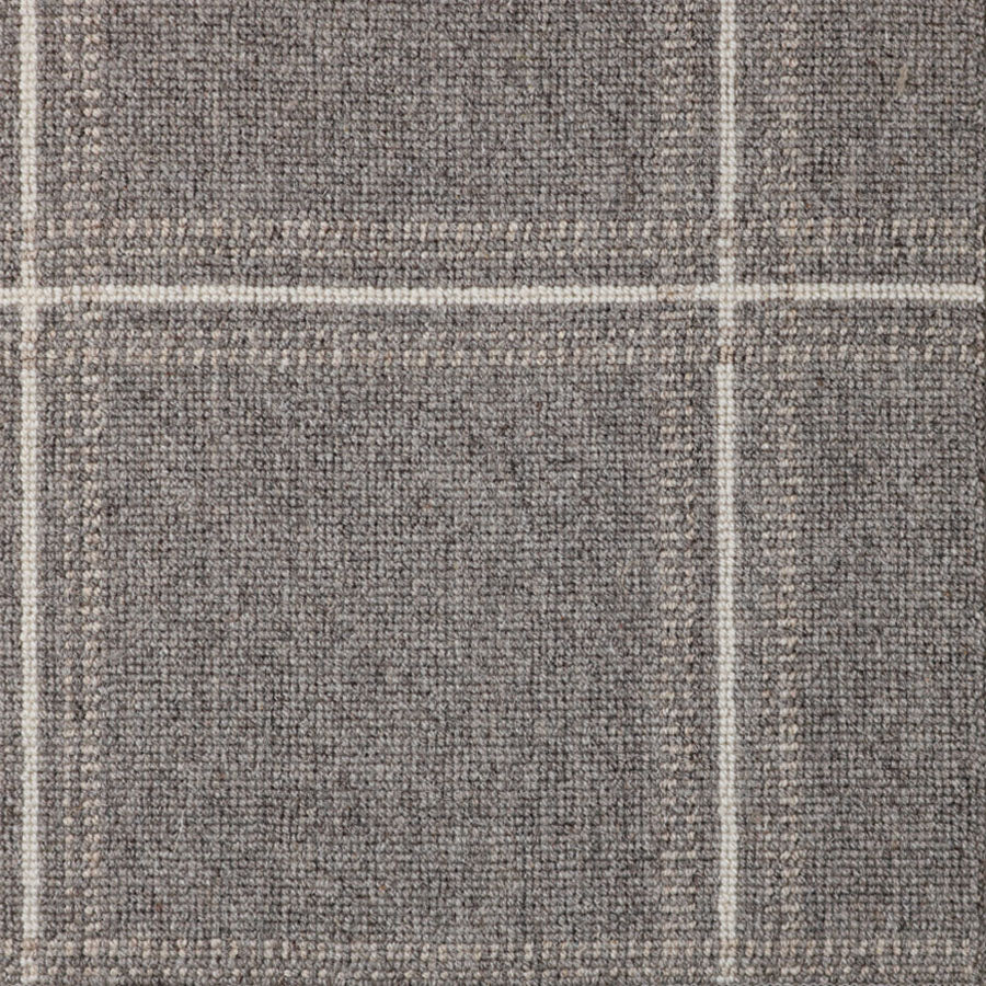 Broadloom carpet with window pane check in white and beige on grey.