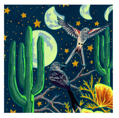 Detail of wallpaper in a statement desert print with a cactus, birds, flowers and moon. Field is navy.