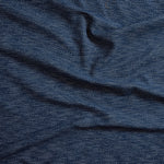 Close up of gently draped woven Indoor-Outdoor fabric with basketweave texture in navy blue and dark green.