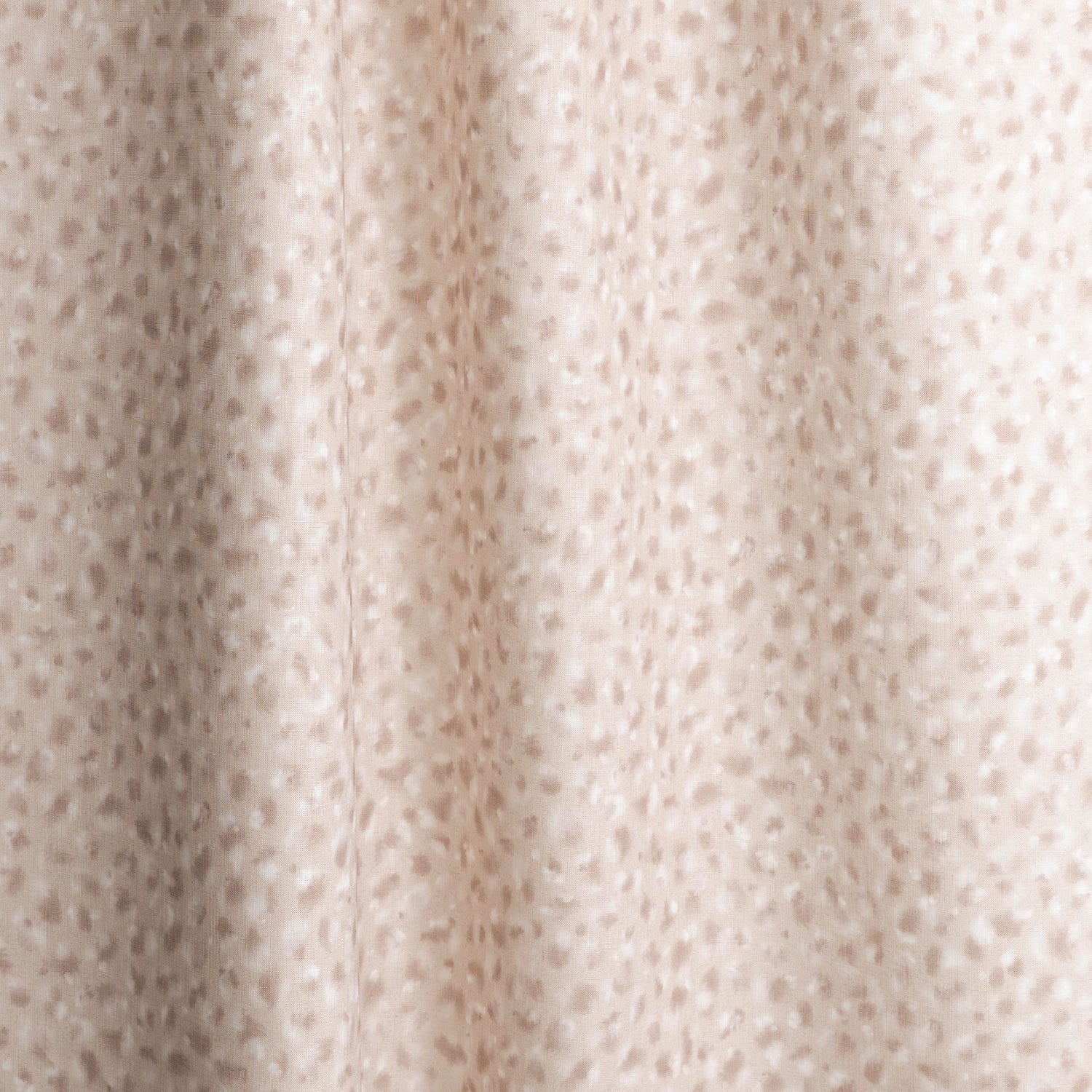 Gently draped fabric in a painterly animal print in pastel pink with white accents. 
