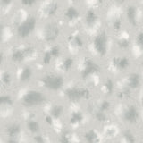 Close up detail of wallpaper in a painterly animal print in shades of cool blue and white. 
