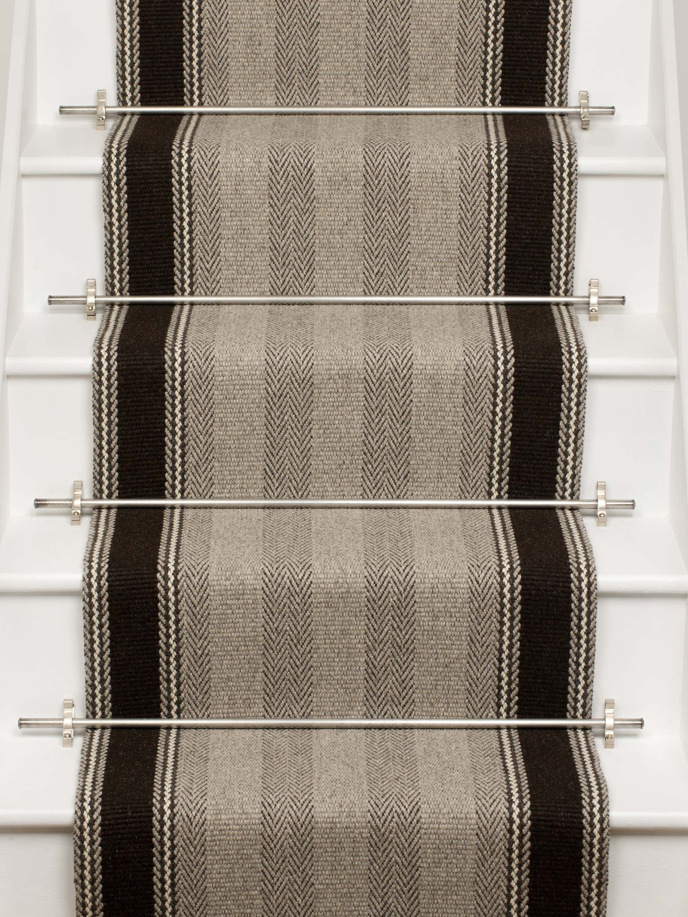 Striped flatweave runner in grey and black on white staircase