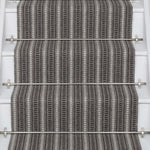 Striped flatweave runner in grey and black on white staircase