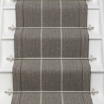 Striped flatweave runner in grey and black on white staircase