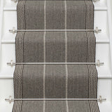 Striped flatweave runner in grey and black on white staircase