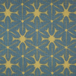Detail of fabric in a shibori grid print in mustard on a navy field.