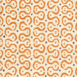 Detail of fabric in a curvilinear stripe pattern in orange and purple on a cream field.