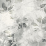 Close up detail of wallpaper in a painterly leaf print in shades of cool steel grey with a mottled white overlay.