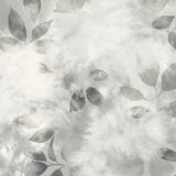 Close up detail of wallpaper in a painterly leaf print in shades of cool steel grey with a mottled white overlay.