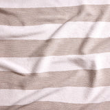 Close up of gently draped woven Indoor-Outdoor fabric with wide textural stripes in white and taupe.