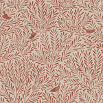 Detail of fabric in a playful bird and leaf print in red on a cream field.