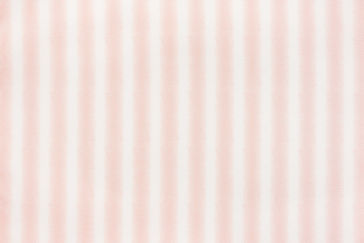Detail of fabric in a textural speckled stripe print in dusty rose and cream.