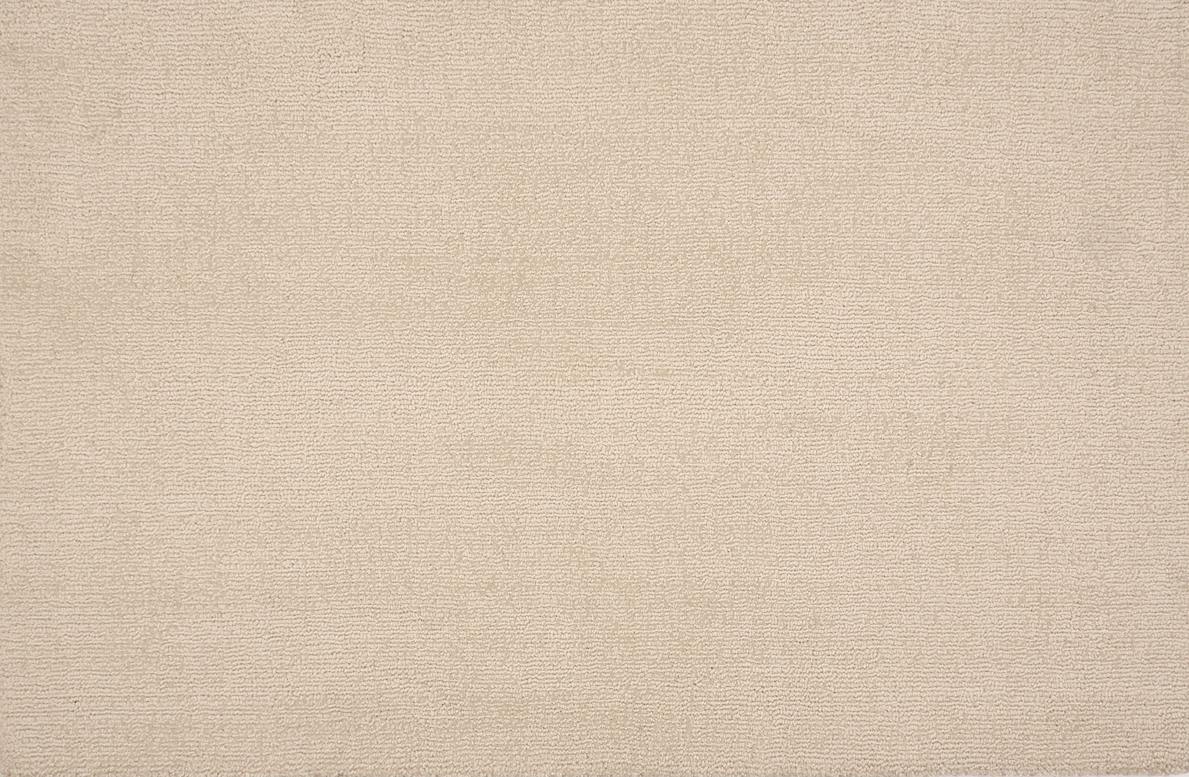 Broadloom carpet in a cut pile strié design in ivory.