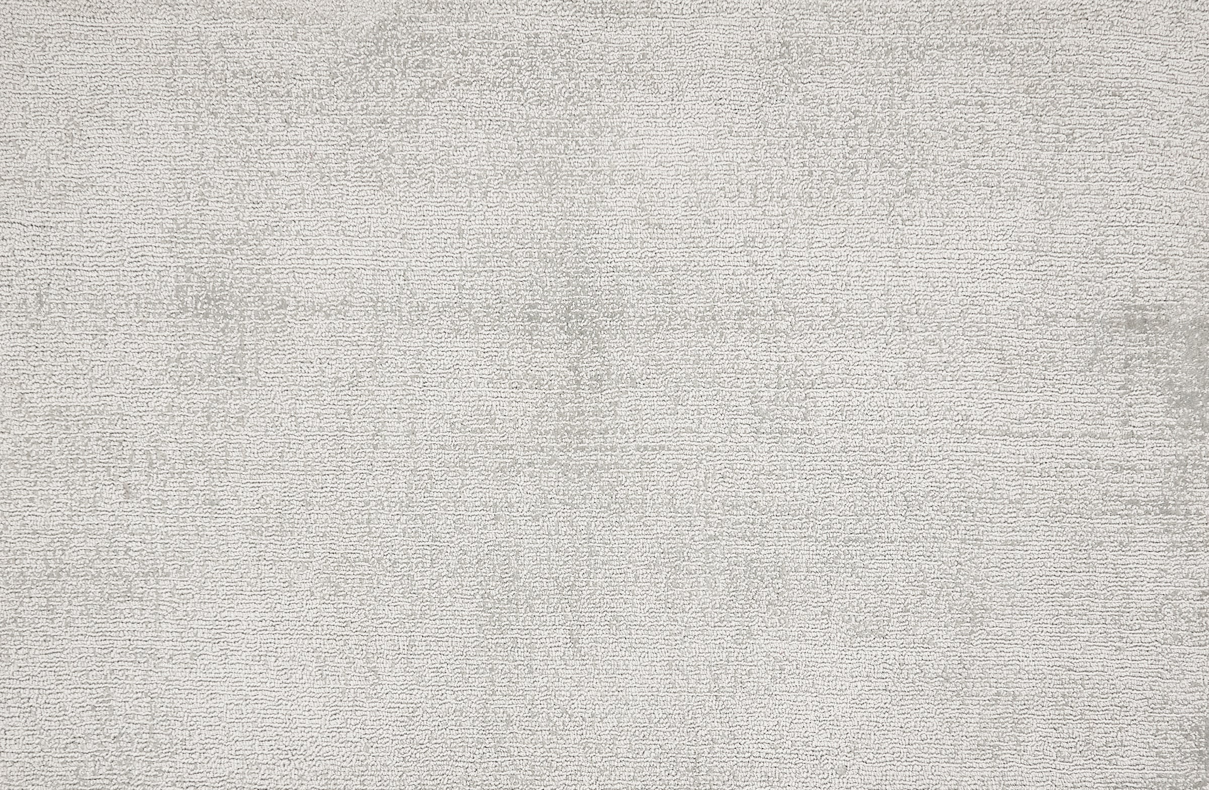 Broadloom carpet in a cut pile strié design in silver